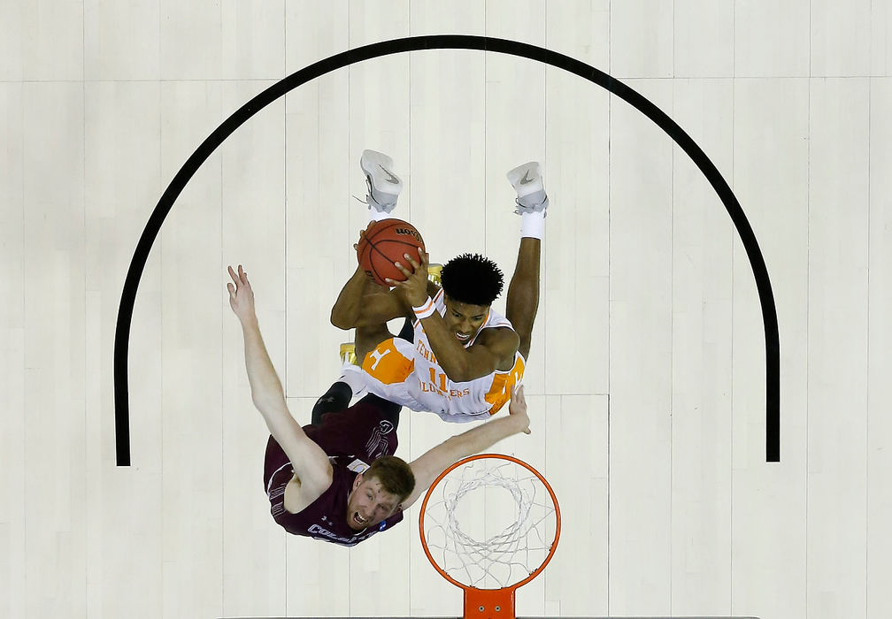 Sports - 1st placeTennessee forward Kyle Alexander (11) shoots as Colgate forward Will Rayman (10) defends during the first half of a NCAA Division I tournament first round game at Nationwide Arena in Columbus.(Joshua A. Bickel / The Columbus Dispatch)